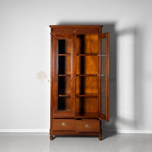 На фотографии изображен книжный шкаф из коллекции Мария Сильва в цвете Noce Chiaro